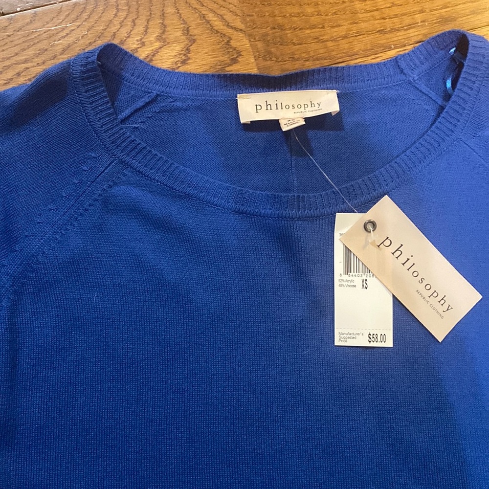 Philosophy blue sweater.